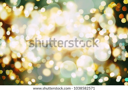 abstract blurred of blue and silver glittering shine bulbs lights background:blur of Christmas wallpaper decorations concept.xmas holiday festival backdrop:sparkle circle lit celebrations display.
