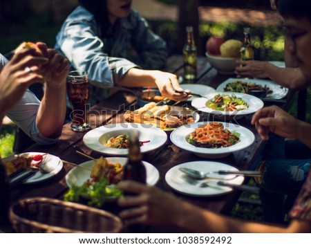 People are eating on vacation. They eat outside the house. Royalty-Free Stock Photo #1038592492