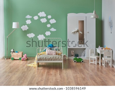 Modern baby room green background white bed and cupboard or cabinet cloud pattern on the wall