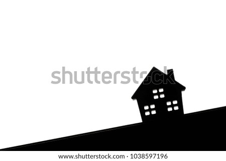 Concept of silhouette hard paper house on floor , a symbol for construction , ecology, loan, mortgage, property or home.