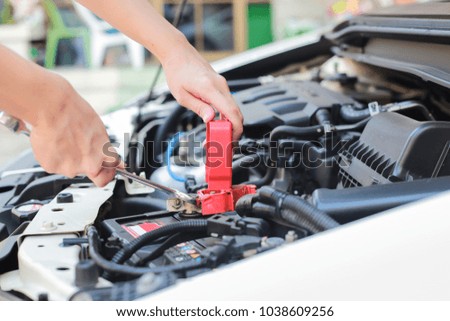 Auto mechanic working at outdoor. Repair service concept