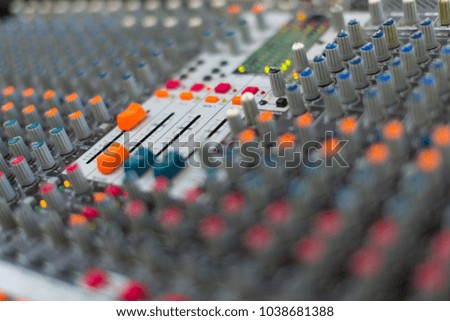 Analog sound mixer with selected focus. Professional audio mixing console radio and television broadcasting. Horizontal shot.