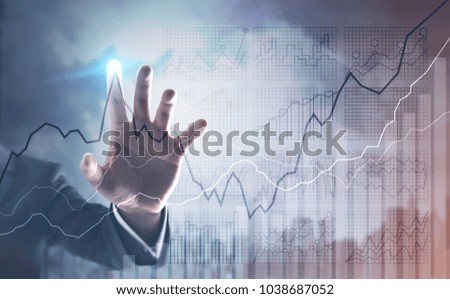 Hand of an unrecognizable businessman interacting with a visual screen element. Diagrams and stats. A city sky background. Toned image double exposure mock up