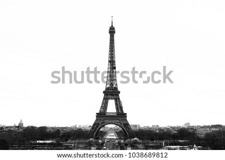 Black and White Eiffel Tower with the skyline in Paris with the city in the background.