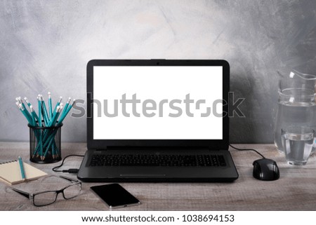 Workspaces mock up Laptop on wood table with glass phone smartphone pencil apple notebook mouse
desk with copy space for graphics or products display montage.Working place of designer,close-up
Office.