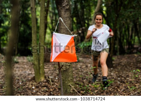 Outdoor orienteering check point activity Royalty-Free Stock Photo #1038714724