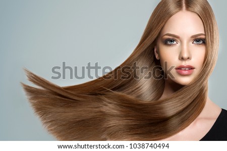Beautiful model girl with shiny brown and straight long  hair . Keratin  straightening . Treatment, care and spa procedures. Smooth hairstyle Royalty-Free Stock Photo #1038740494