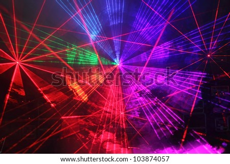 Colourful Disco with special effects and fantastic laser show Royalty-Free Stock Photo #103874057