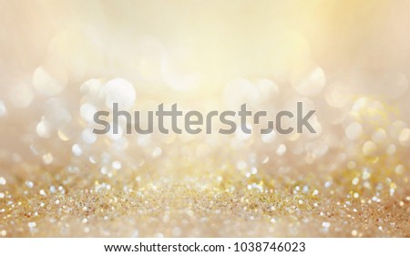 Glitter background golden saturated color ,de-focused, macro. Sparks fall and sparkle, free space.