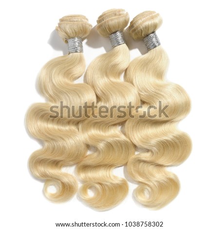 Body wave blonde human hair weaves extensions bundles Royalty-Free Stock Photo #1038758302