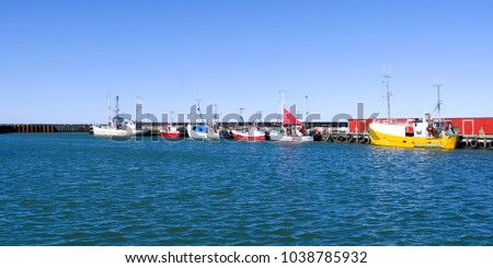 Laesoe / Denmark: Fishing cutters moored at the pier in the fishing port of Oesterby Havn