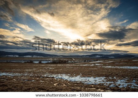 sky and clouds in a meadow at sunset. Rural landscape. Sunny day.