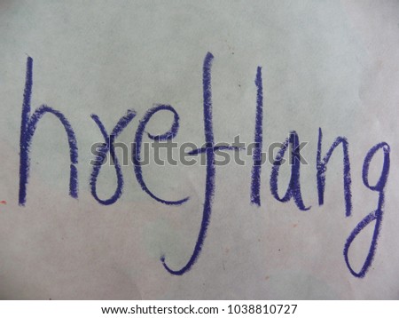 Text hreflang hand written by blue oil pastel on white color paper