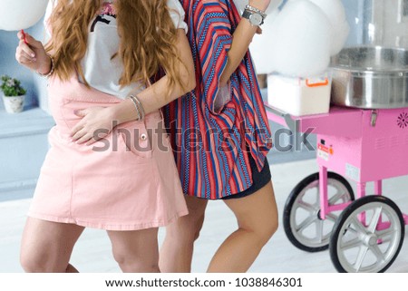 Close-up photo of smooth female legs. Two girls.