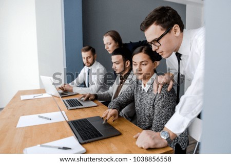 Group of businessmen working with a laptop