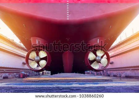 Stern ship propeller twin of Tugboat under the Overhauled in floating dry dock in shipyard thailand Royalty-Free Stock Photo #1038860260