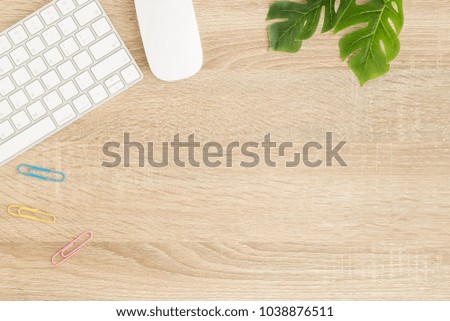 Flat lay photo of office desk with mouse and keyboard ,Top view workpace on wood table and copy space 
