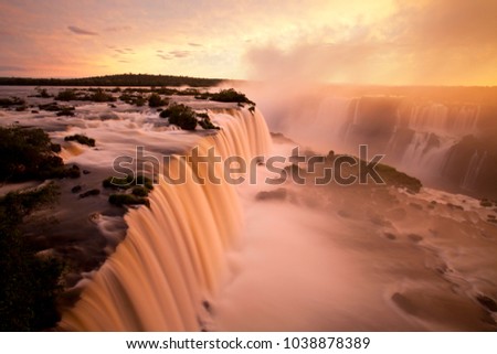 Floriano waterfall sighted from the footbridge of the National Park of Iguazu Falls - Foz do Iguaçú, Brazil - A wonder of nature between Brazil and Argentina Royalty-Free Stock Photo #1038878389