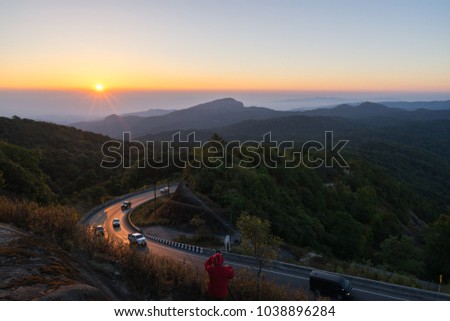 The Photographer take a photograph in the morning with sunrise at viewpoint of Doi Inthanon National Park, the top highest mountain of Thailand
