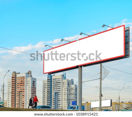 Blank white billboard on background with multi story buildings, walking peoples and passing cars, mockup