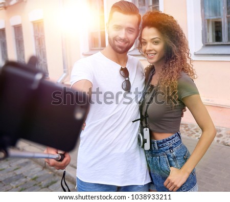 Happy traveling couple making selfie, romantic mood.
