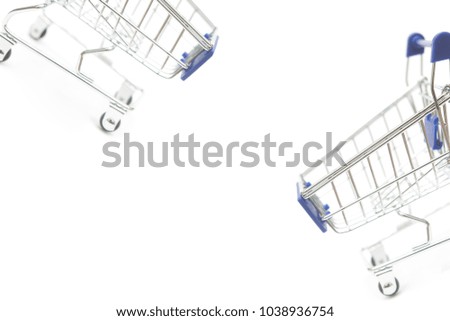 metal shopping cart isolated on white background in random composition