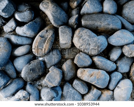 Close up abstract and pattern of gray or black gravel stones. Small or Big rocks textured