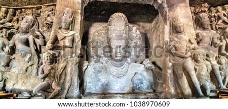 Trimurti Sadashiva sculpture in the cave 1 on Elephanta Island. Mumbai - Maharashtra, India Royalty-Free Stock Photo #1038970609