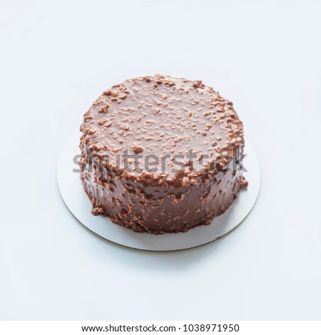 Round chocolate cake on white backgroun. Food blogging. Top view. Empty space.