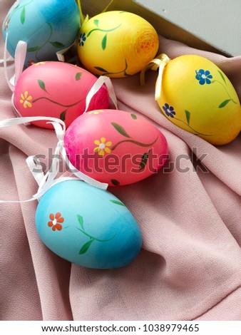 easter eggs with flowers paintings. cozy Easter wallpaper. easter eggs on textile background. hello easter.