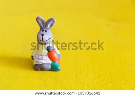 Easter rabbit dressed in apron. Easter postcard. Copy space.