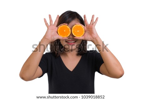 Portrait of young Asian woman. holding orange slices in front of her eyes and smile isolated on white background. Healthy food concept. Diet concept. Woman want body perfect