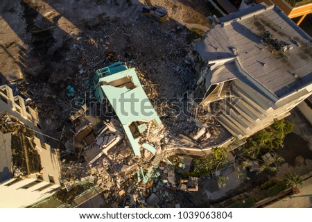 Aerial drone photo of a building under demolition rubble aftermath earthquake
