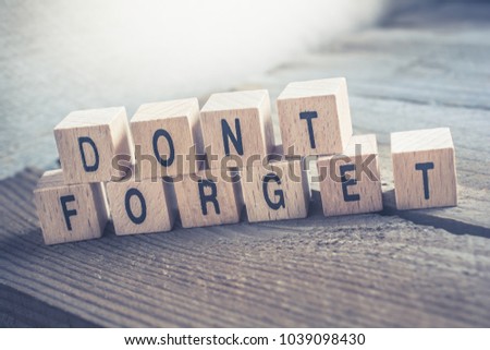 Macro Of A Don't Forget Reminder Formed By Wooden Blocks On A Wooden Floor Royalty-Free Stock Photo #1039098430