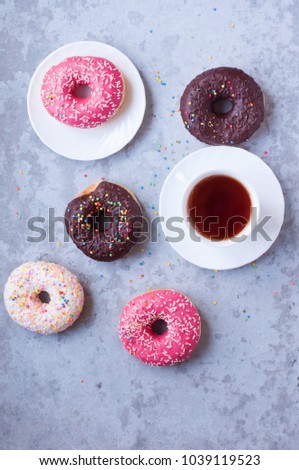 Donuts with icing on pastel background. Sweet donuts. dessert