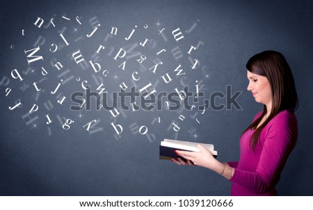 Casual young woman holding book with white letters flying out of it
