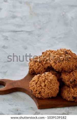 Top view close-up picture of tasty chocolate cookies on the cutting board, shallow depth of field, selective focus