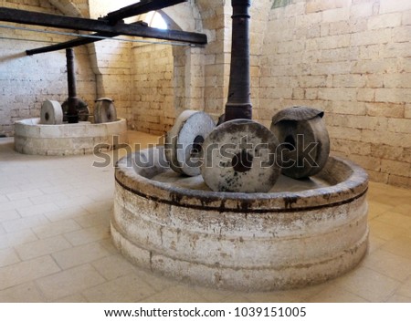an ancient millstone.