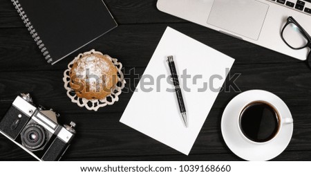 coffee with a cupcake on a black background