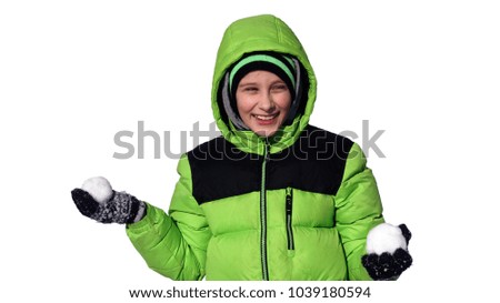  
A boy in a winter jacket with snowballs in his hands. Isolates on white
                             
