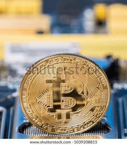 Bitcoin crypto currency on a computer motherboard
