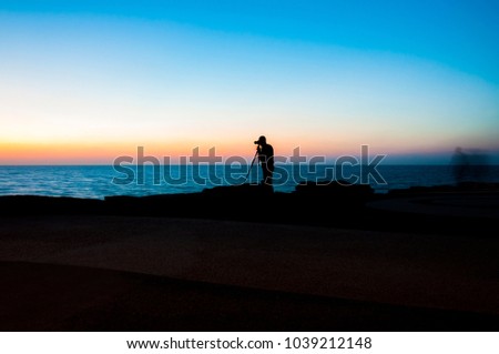 Evening photography. Golden hours shoot. Sunset above the sea in Tel Aviv. Working photographer.