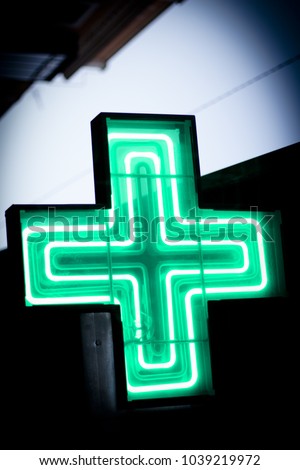 Luminous green cross. No people