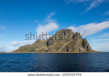 Alden island in Askvoll Municipality western Norway. The island is most notable for its magnificent 460-metre tall mountain called "Norskehesten". Royalty-Free Stock Photo #1039224793