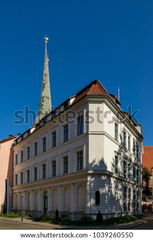 Pure elegance: listed corner building at Berlin "Nikolaiviertel" ("Nicholas' Quarter), in the background the spire of the "Nikolaikirche" ("St. Nicholas Church")