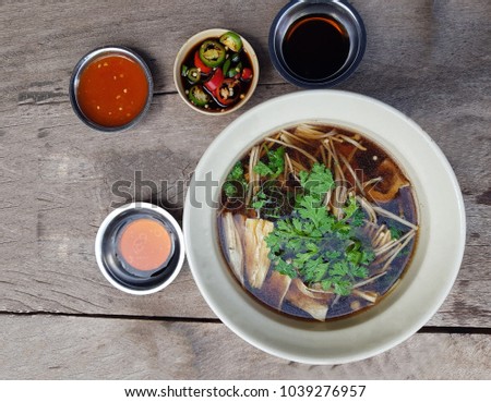 Bak kut teh or meat bone tea is a traditional dish of Malaysian Riau Islands,healthy diet there are in put mushroom, soup very delicious and favor in southern of Thailand
 Royalty-Free Stock Photo #1039276957