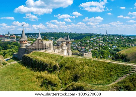 Photo of old ancient stone castle with many hight towers in Kamyanets-Podilsky