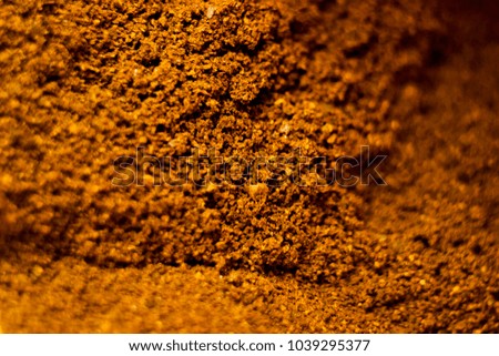 freshly ground organic coffee, closeup with shallow depth of field