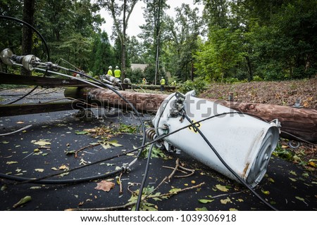 Down power lines and electric equipment in residential neighborhood Royalty-Free Stock Photo #1039306918
