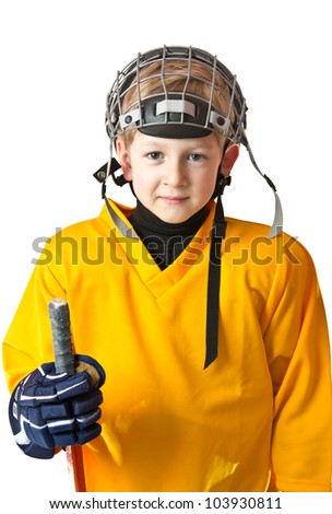 Portrait of cute young boy in hockey uniform with facial mask on top of the head
